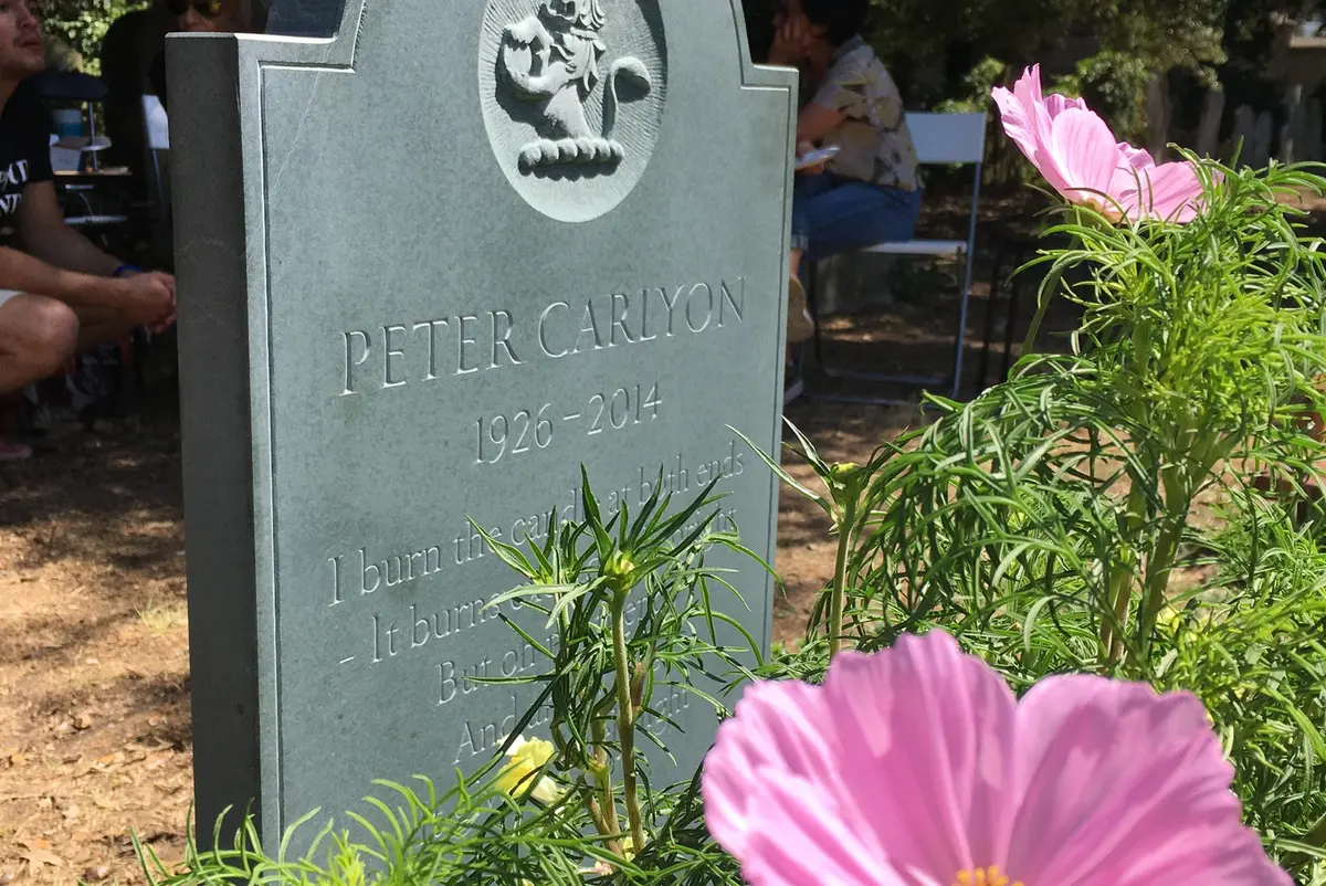 green slate gravestone with carving