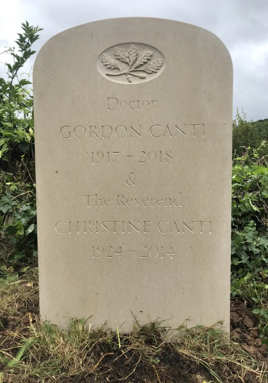 Double headstone with surname repeated