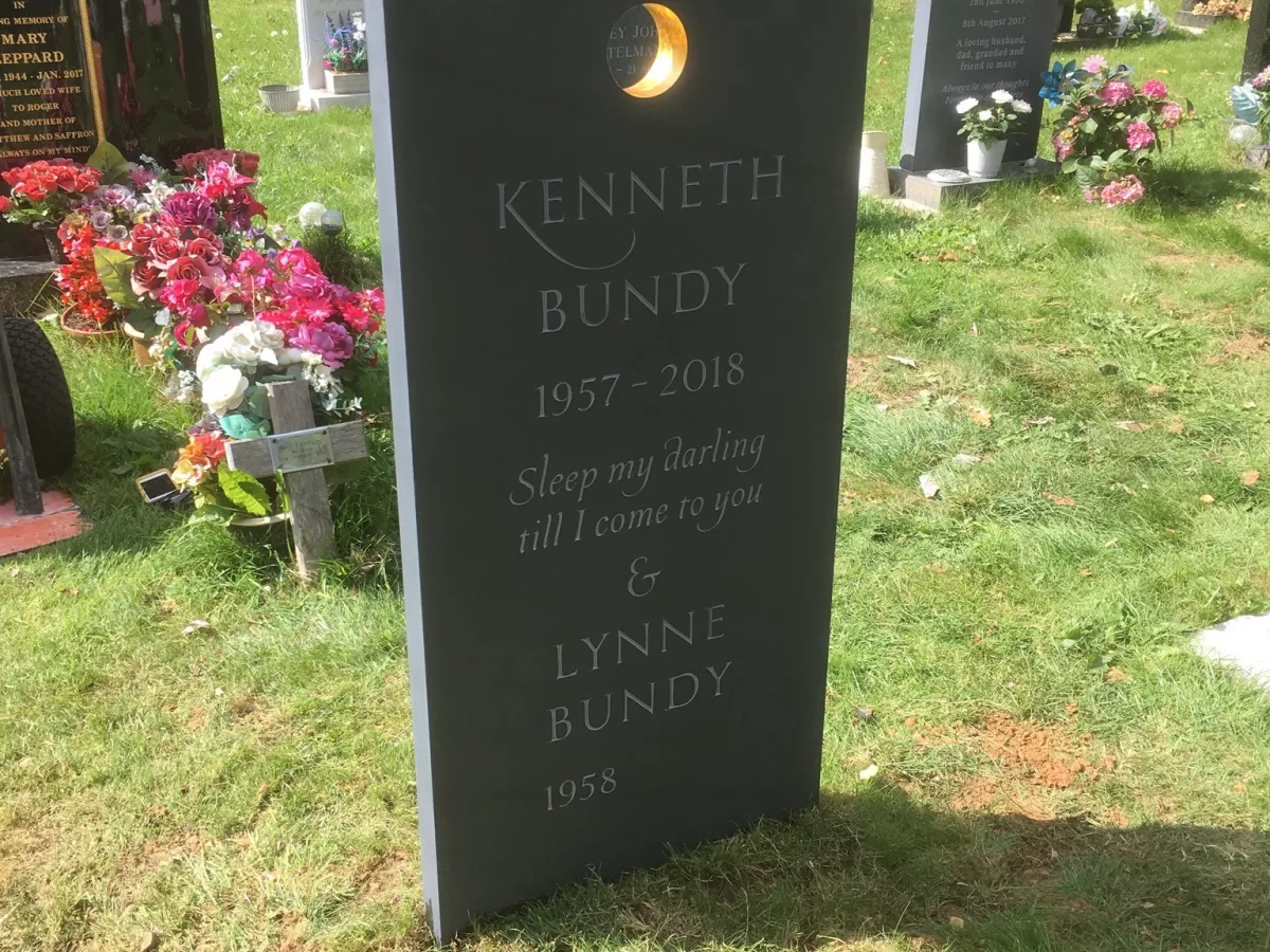 Slate headstone with gold disc