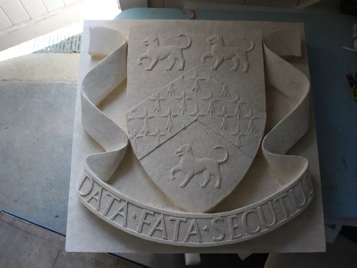 School crest in stone