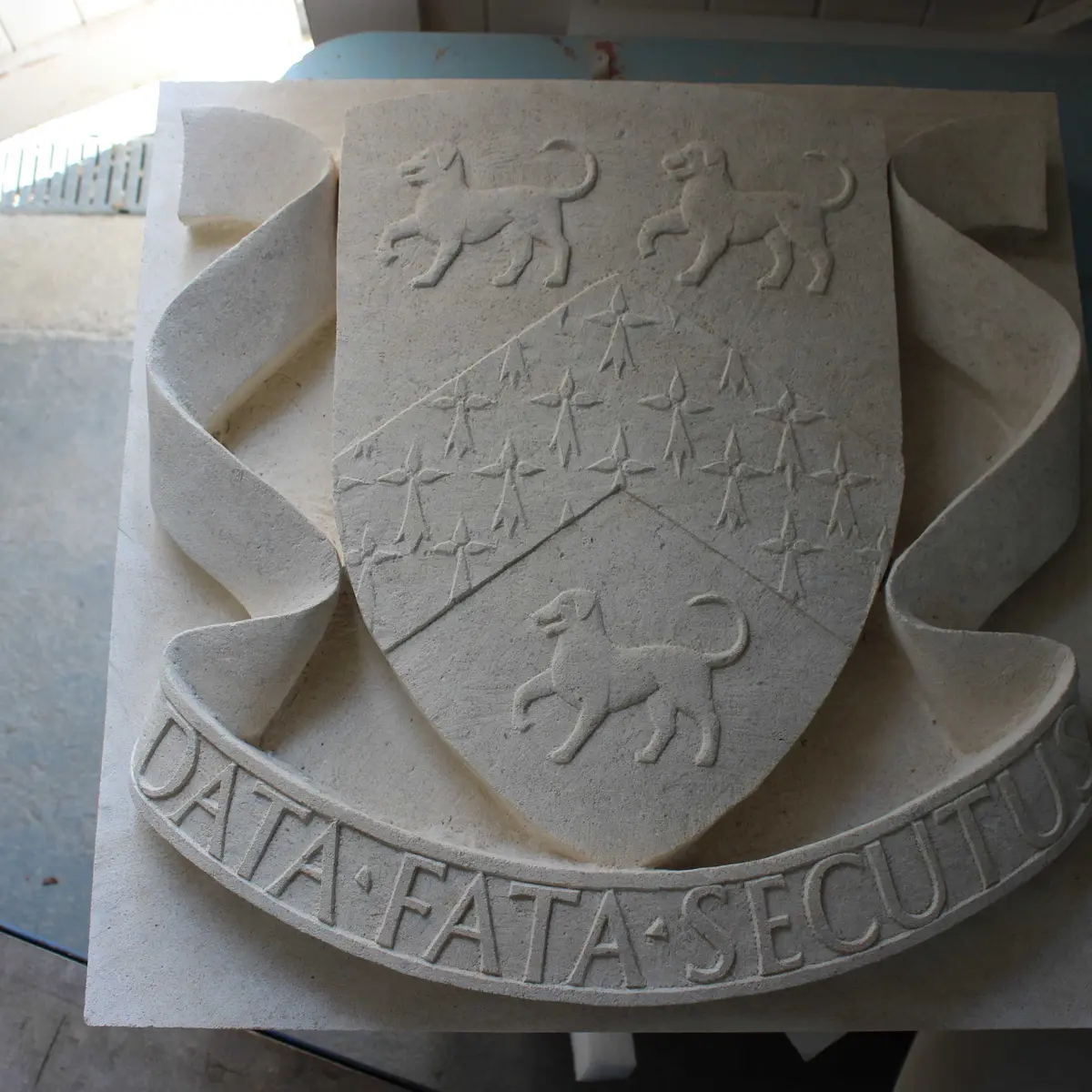 School crest in stone