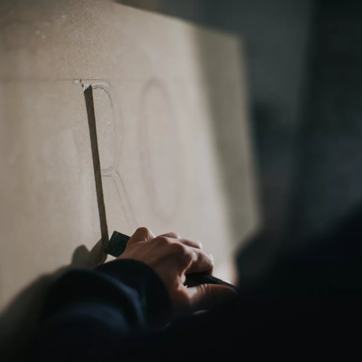 Carving a letter in stone