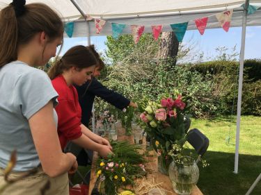 arranging funeral flowers