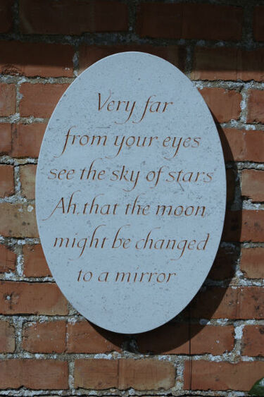 garden wall plaque painted