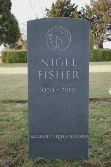 slate headstone with line carving of horse