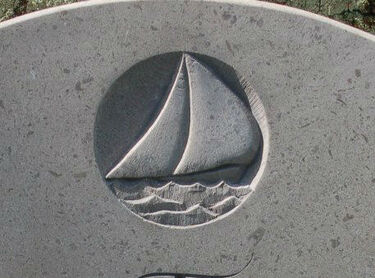 boat carved in relief on headstone