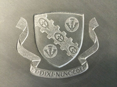 crest on slate headstone