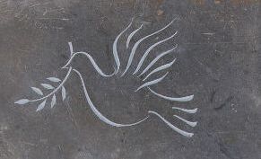 line carving of dove on slate headstone