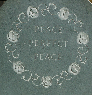 poppies in a circle on headstone
