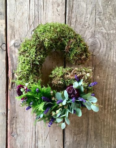 letter G in moss funeral flowers