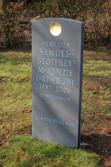 Slate headstone with disc