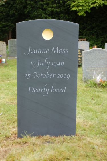 Headstone with gold disc Headstone with gold disc