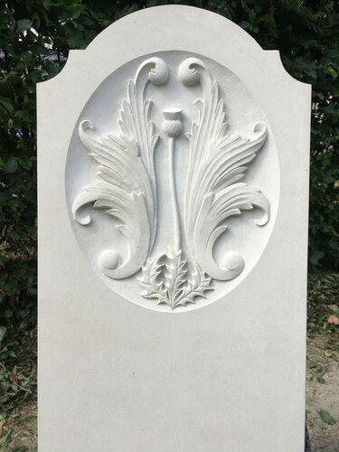 headstone with carving in portland limestone