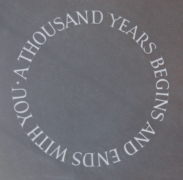 circular lettering on a gravestone