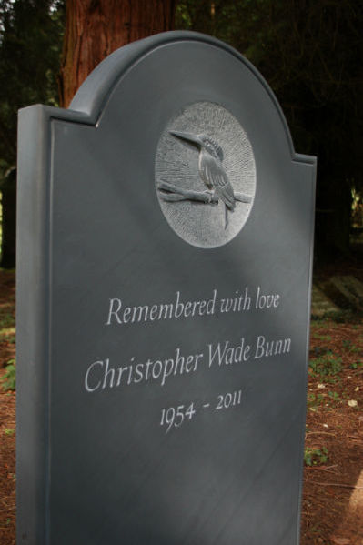 slate headstone with relief carving