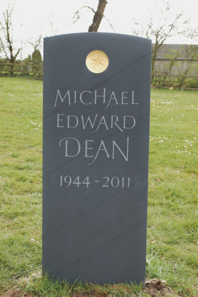 hand carved memorial with gilded sunken disc