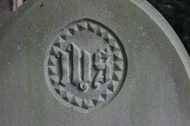 ihs symbol on gravestone