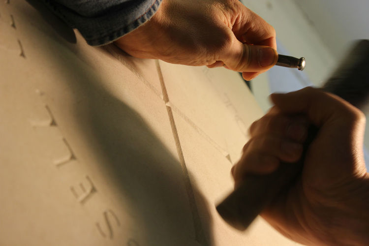 carving cross on headstone