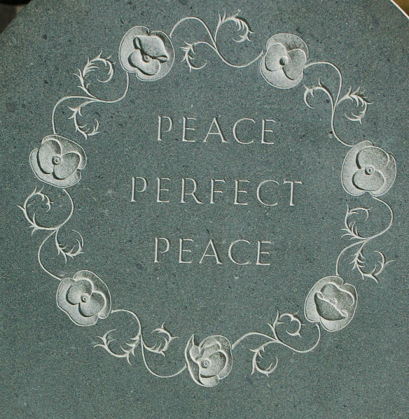 poppies in a circle on headstone