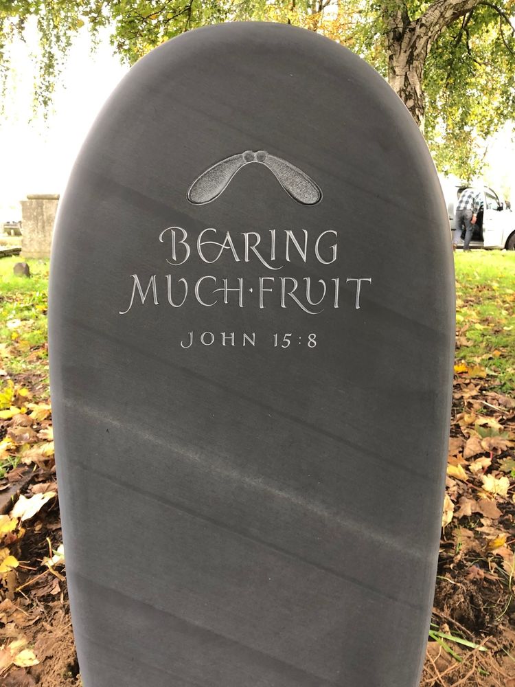 Slate headstone for grave with carving