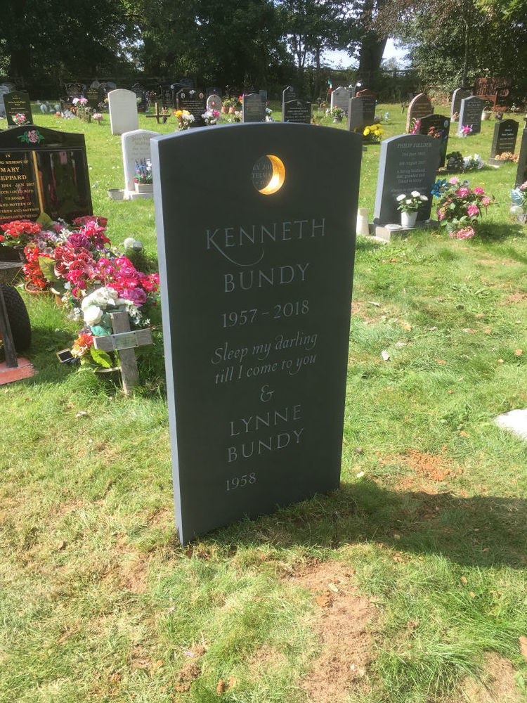 Unique slate headstone with golden circle