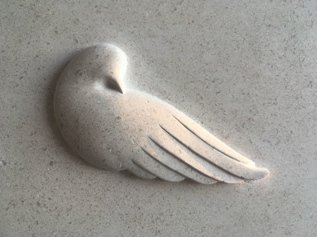 dove symbol on gravestone