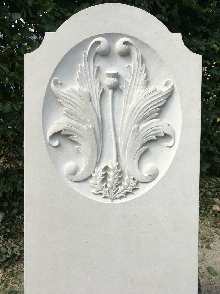 headstone with carving in portland limestone